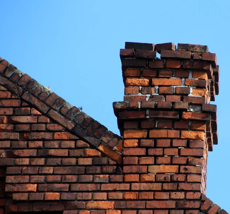 Signs Your Bolton Home Needs a Chimney Inspection Damaged chimney on an Bolton home showing cracks and missing mortar